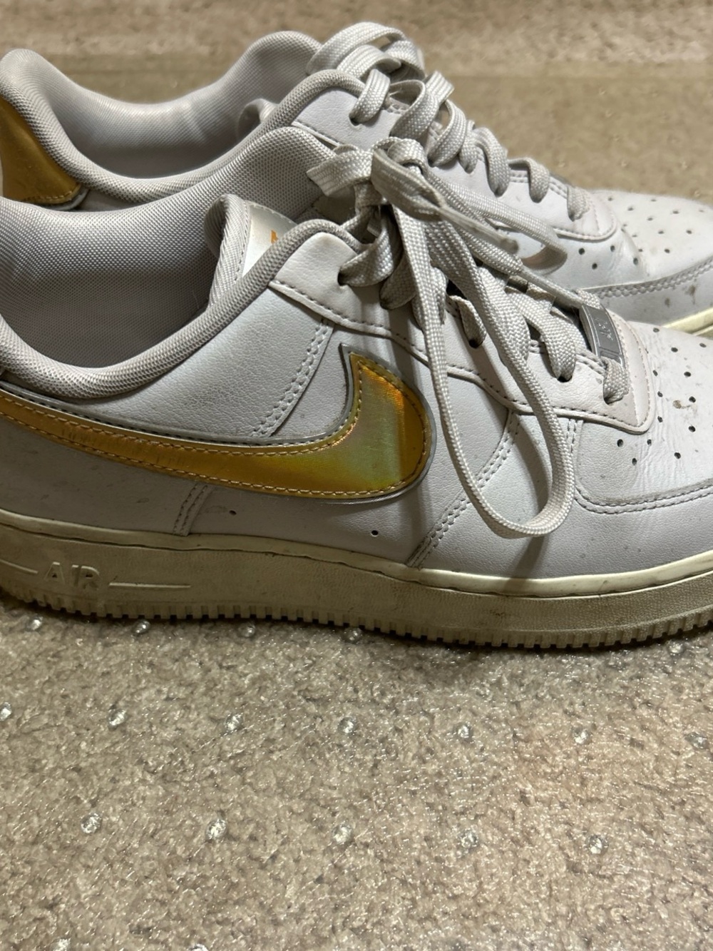 Nike White Athletic Shoes with Gold Swoosh